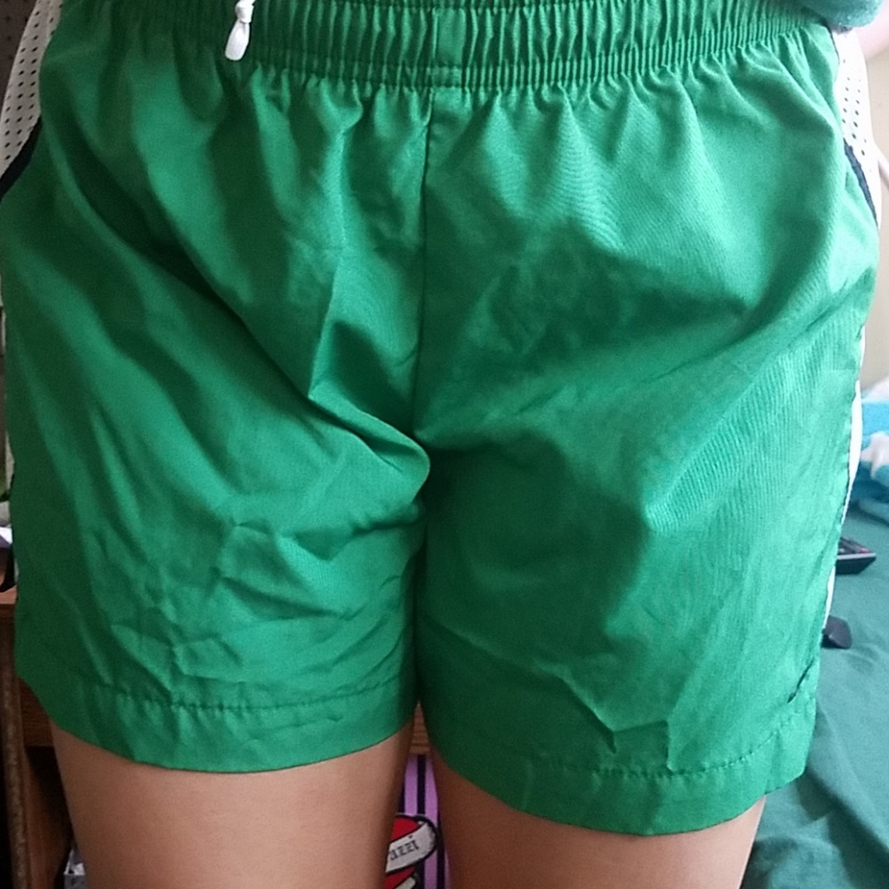 Green Nike running shorts